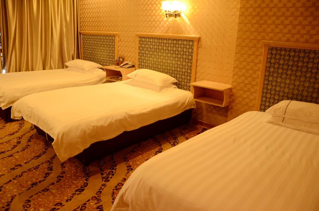 Omeiga Business Hotel Yiwu (Zhejiang) Chambre photo